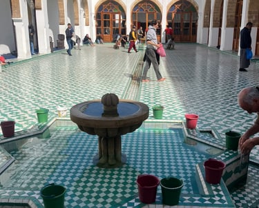a man doing ablution in a courtyard