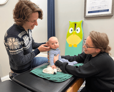 Franklin pediatric chiropractor adjusting baby to help with ear infections.