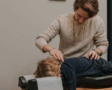 Child who is struggling with sleep and energy issues calmly getting adjusted in Franklin, TN