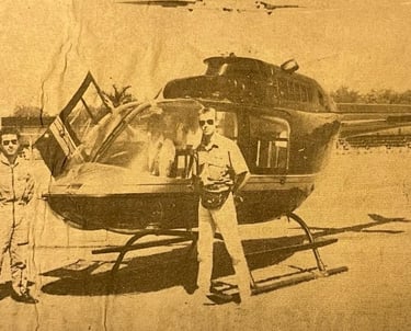 a man standing next to a helicopter