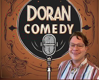 a man in a striped shirt and glasses with a microphone