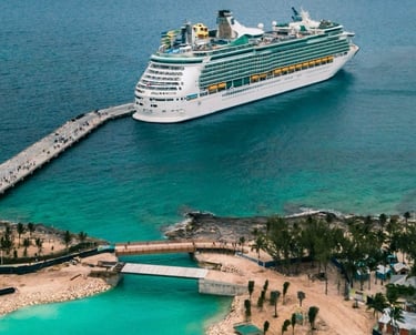 a cruise ship docked at a dock with a cruise ship