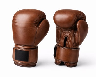 Brown leather boxing gloves with padded knuckles and wrist support for training and professional use