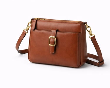 Brown leather crossbody bag with adjustable strap and front buckle detail
