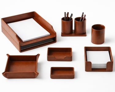 Matching leather desk accessories set including trays and holders for organized workspaces.
