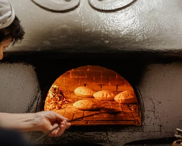 Traditional Sardinian bread baking in a wood-fired oven