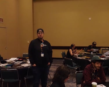 Jacob stands watch over the tables.