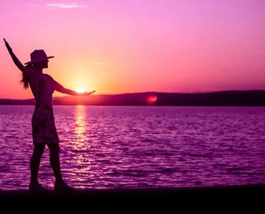 a woman standing on a beach