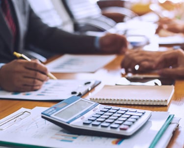 a group of people doing financial analysis