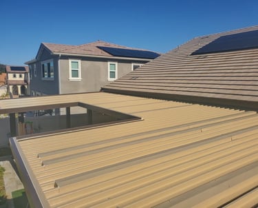 Veiw of 2 story homes and top of Alumawood patio cover.