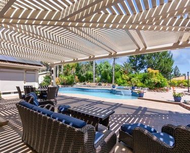Large Alumawood lattice shade structure with double beam and rafters and mitered corner, poolside.