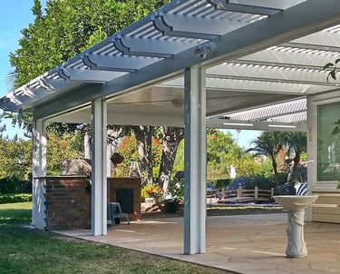 White custom Alumawood shade cover with solid mitered corner and open lattice side sections. 