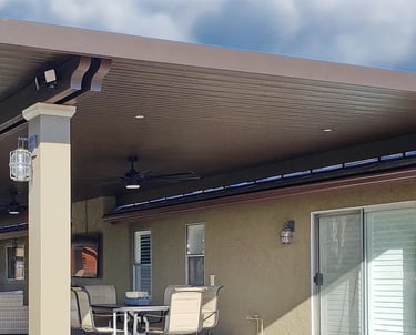 Large Alumawood patio structure mounted to top of tile roof.