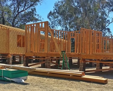 Modular home offsite framing on crib bracing in Menifee.