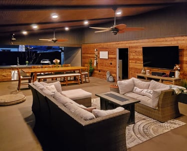 Fully furnished outdoor living room and kitchen.