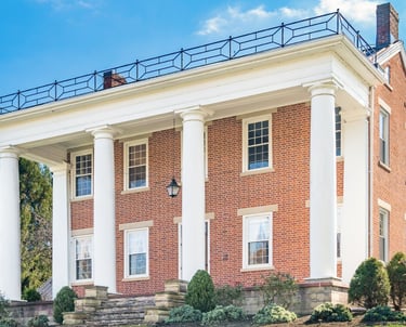 a large brick building with columns and columns