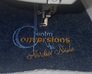 Close-up of stitching, denim texture, denim conversion logo