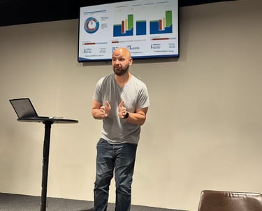 Dave Brock presenting IT and operations data at Rock of Grace, supporting small team systems and tech strategy.