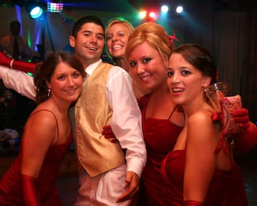 Wedding Party Family in Sheboygan. Hosted by ISDJ. Bridesmaids in red dresses. 