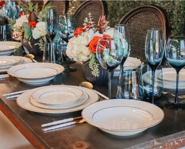 a table setting with a table setting for a dinner paryt planner.