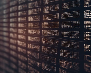 black click pen beside MacBook Pro on table