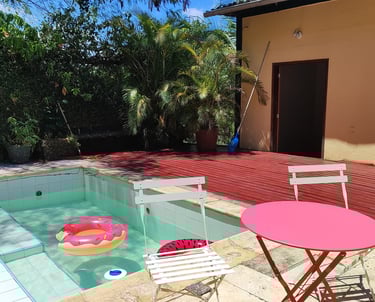 a table with a pink table and chairs