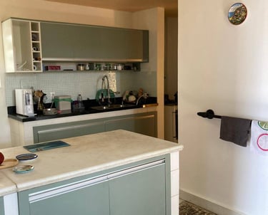 a kitchen with a counter top and a towel rack