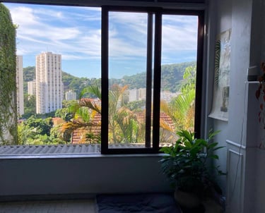 a view of a window with a view of a city