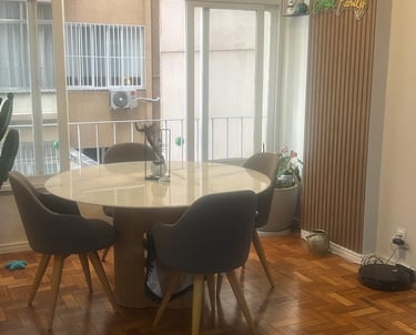 a dining room with a table and chairs