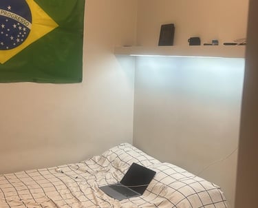 a bed with a laptop computer 