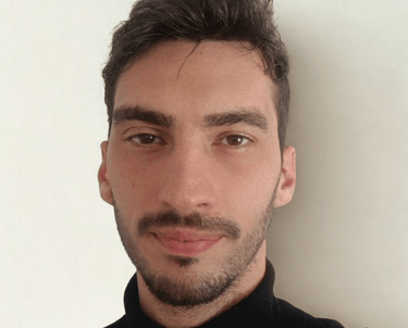 a man with a beard and a black shirt