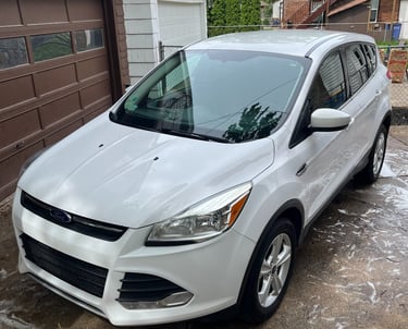 post exterior full detail on white Ford escape SUV with paint sealant