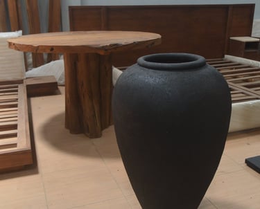 Handcrafted black terracotta vessel with volcanic texture and minimalist form, symbolizing balance b