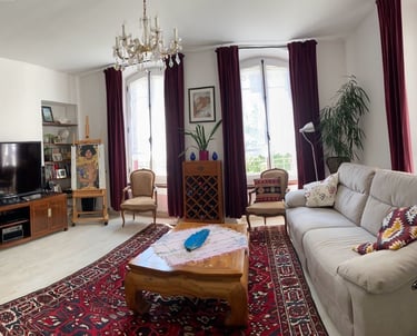 a living room with a couch and a television