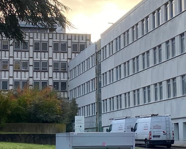 a microwave oven and refrigerator in front of a building