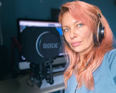a woman with headphones and headphones on a microphone