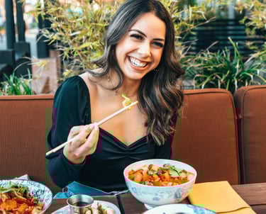 beautiful lady smiling and eating healthy dishes wraps veggie bowl in restaurant