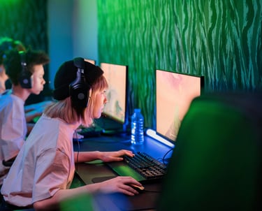 A woman on a PC playing a videogame