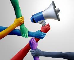 bullhorn held by 6 hands