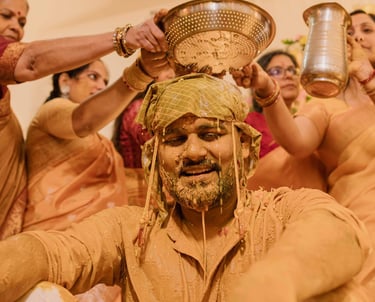 Bride smiling during vibrant Haldi ceremony captured by Mandap Pictures wedding photographers in India.