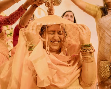 Bride smiling during vibrant Haldi ceremony captured by Mandap Pictures wedding photographers in Ind