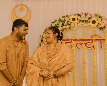 Bride smiling during vibrant Haldi ceremony captured by Mandap Pictures wedding photographers 