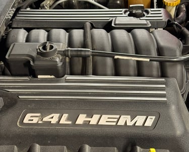 an Enlab car engine with a number of engine parts on it