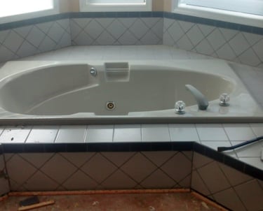 Before demoing tile around the tub surround .