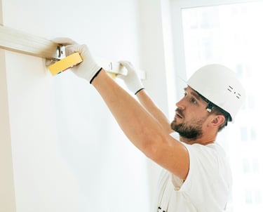 a man in a white shirt and a white helmet