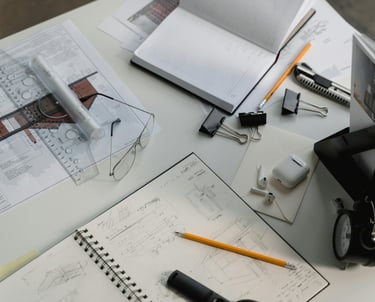 a desk with working stuff