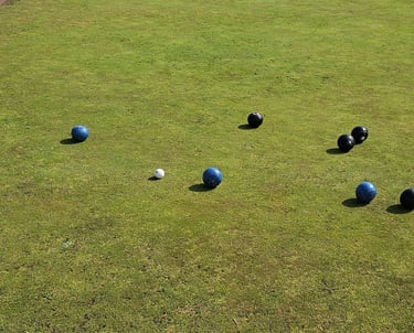 Lawn bowls being played on Porthcawl bowls club green