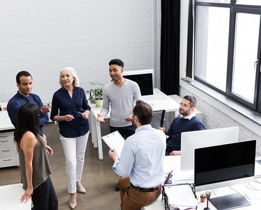 a professional team talking in an office room