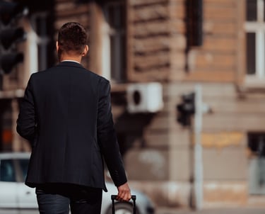 executive in a suit and tie walking down the street