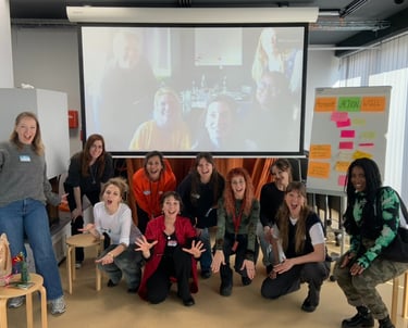 Group of women posing together after a workshop, smiling and appearing confident.